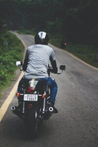 photo of man riding motorcycle