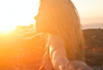 photo of a woman at sunset